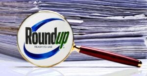 roundup logo and stack of papers