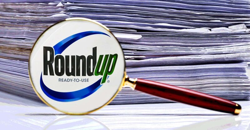 roundup logo and stack of papers
