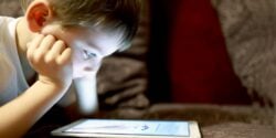 young child using a tablet device