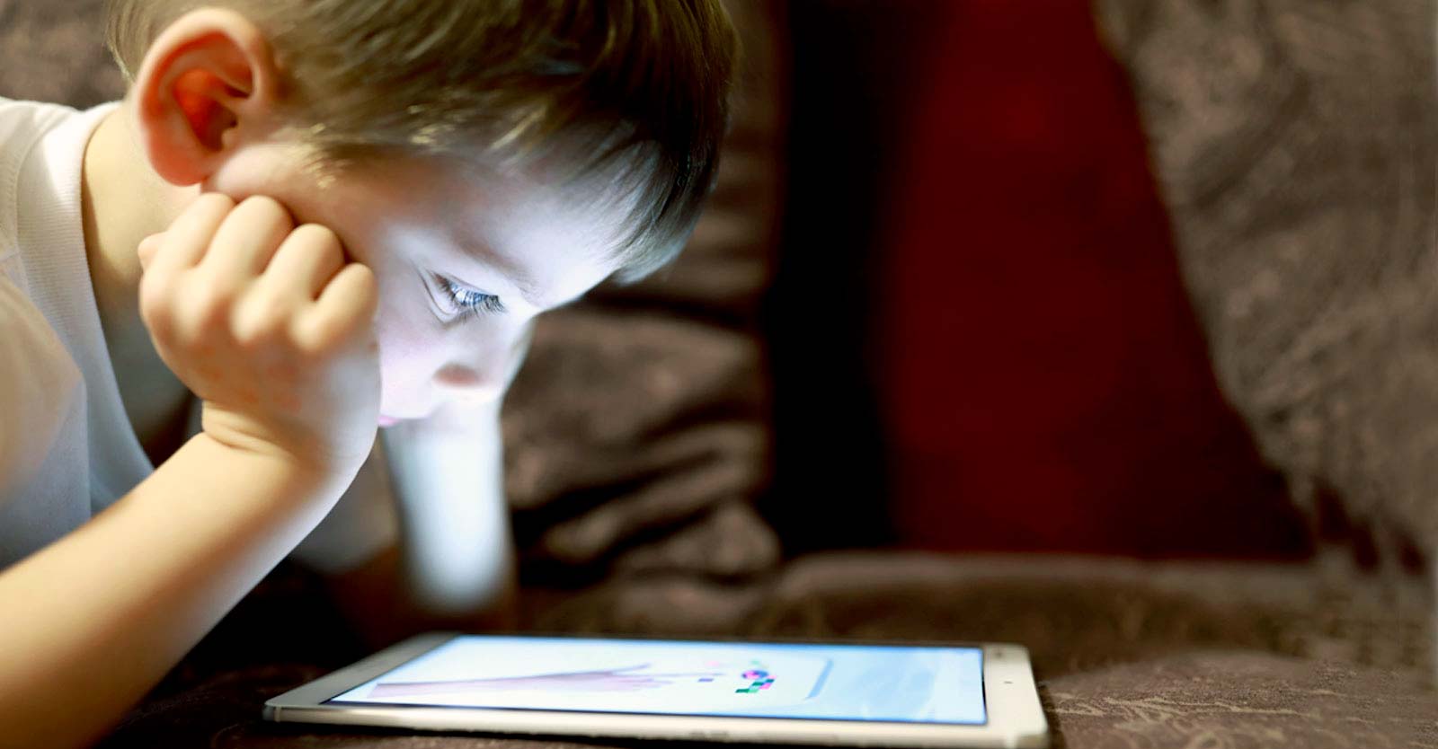 young child using a tablet device