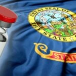 idaho flag and vaccine bottle