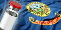 idaho flag and vaccine bottle