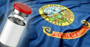 idaho flag and vaccine bottle