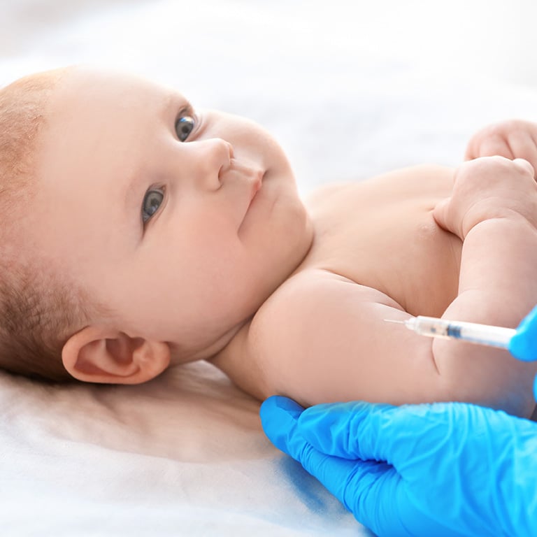 Infant receiving a vaccine.
