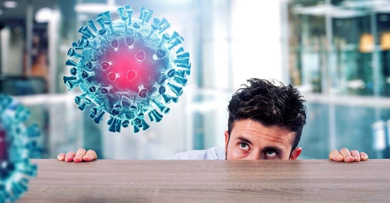 man looking at spike protein virus