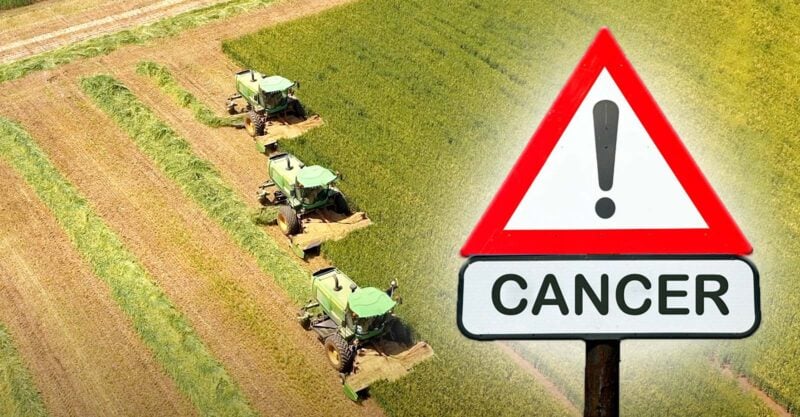 farm field and sign with word "cancer"