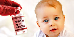 baby and covid vaccine with "3rd dose" on bottle