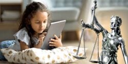 young child on tablet and lady justice