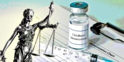 vaccine bottle and lady justice