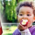 toddler eating an apple