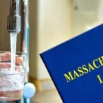 water faucet and book with words "Massachusetts law"