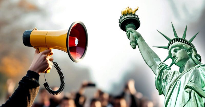 statue of liberty and megaphone at rally
