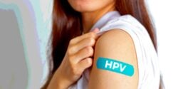 woman with bandage that has "HPV" on it