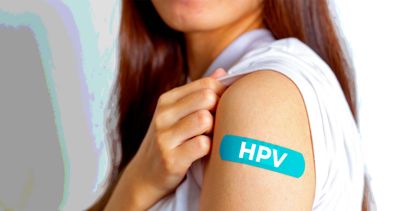 woman with bandage that has "HPV" on it