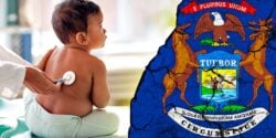 baby at doctor and michigan flag