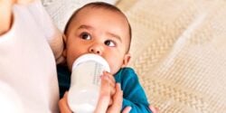 baby drinking formula from baby bottle