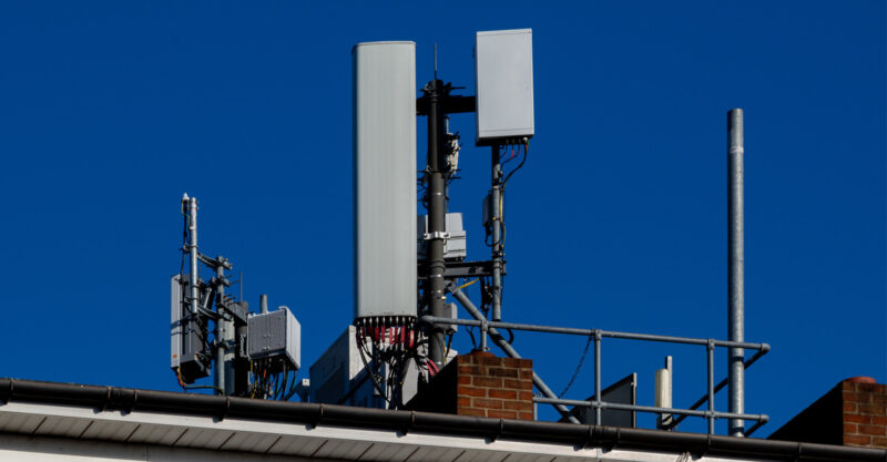 Photo of Installation of 5G equipment on top of apartment building