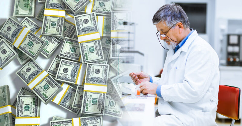 Photo of Senior male researcher carrying out scientific research in a lab and a large pile of one hundred dollar bills.