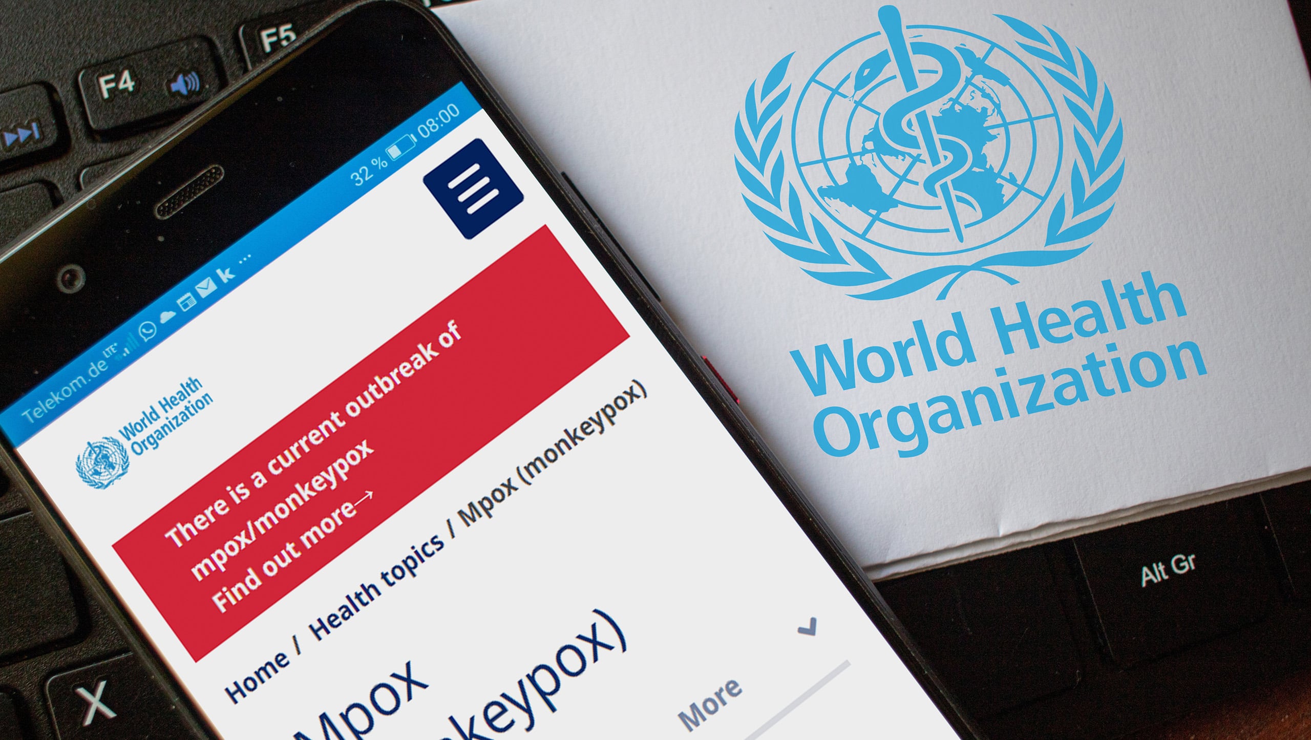 Monkeypox listed on WHO website on smartphone.