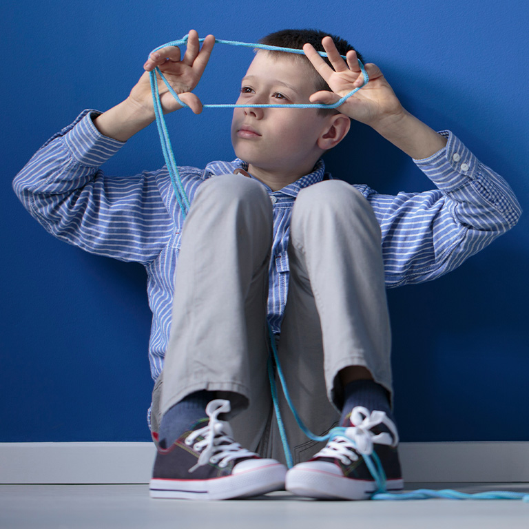 Autistic child playing with blue gum