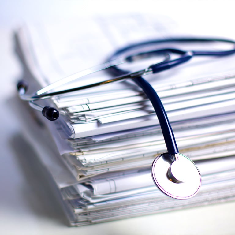 folder file and stethoscope isolated on white background