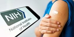 nih logo and bandage over vaccine site on a person's arm