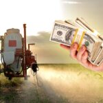 tractor spraying pesticides and business man handing out money