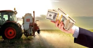 tractor spraying pesticides and business man handing out money