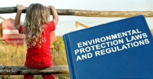 child and book with words "environmental protection laws and regulations"
