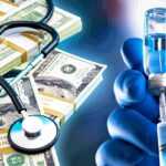 money and a stethoscope and vaccine