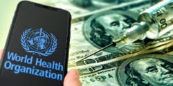 who logo on cellphone and money with vaccine syringe
