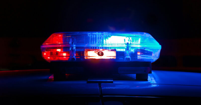Police Lights on top of police car turned on at night