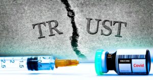 word "trust" and covid vaccine bottle