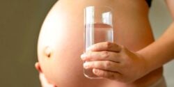 pregnant woman with glass of water