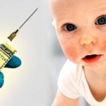 baby and syringe with money