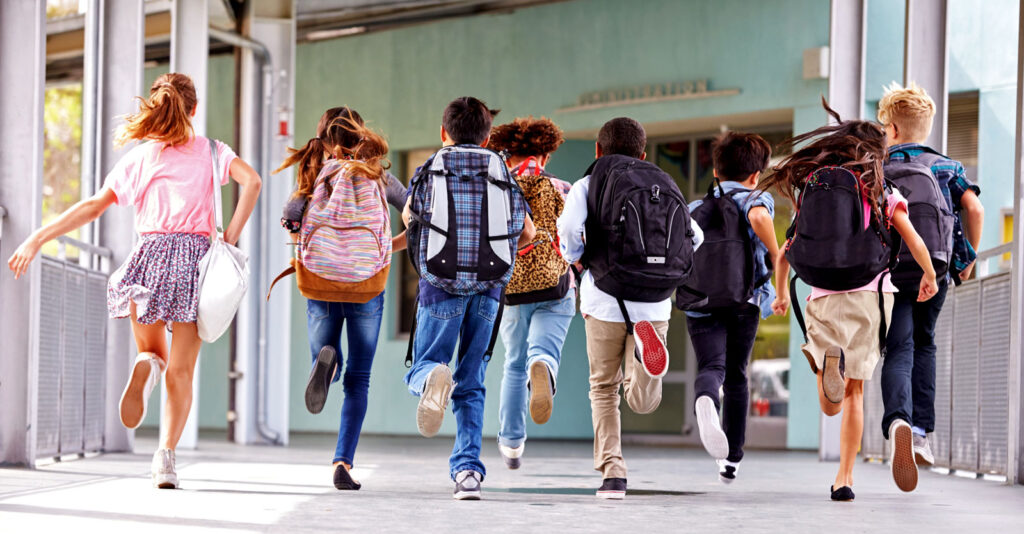kids running into school