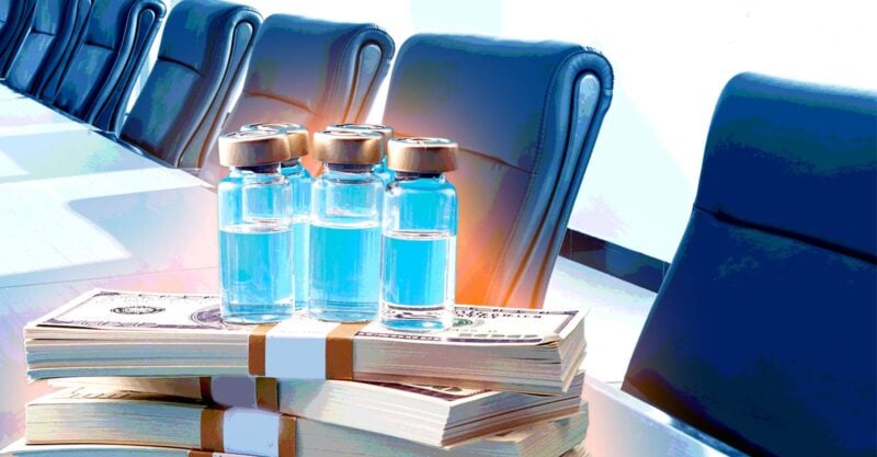 board room with money and vaccines