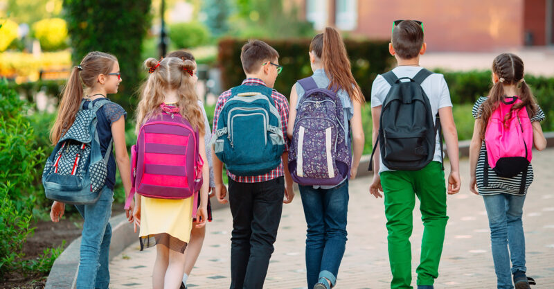Group of children walking together to school.