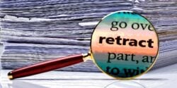 word "Retract" with papers