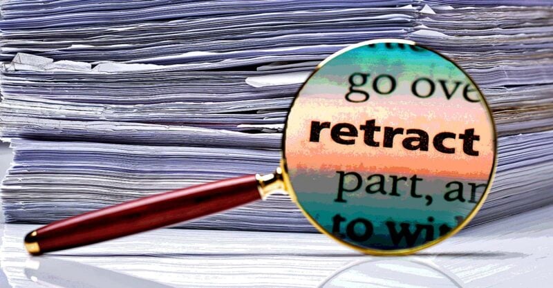 word "Retract" with papers