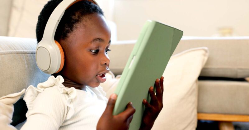 young child on tablet