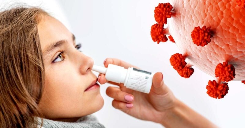 women getting nasal vaccine