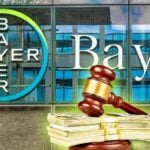 bayer building and gavel with cash