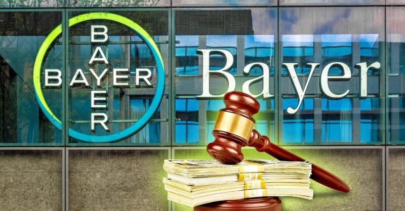 bayer building and gavel with cash