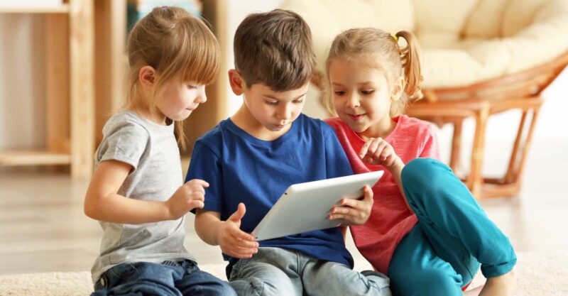 kids sitting with ipad