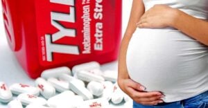 tylenol bottle and pills and pregnant woman