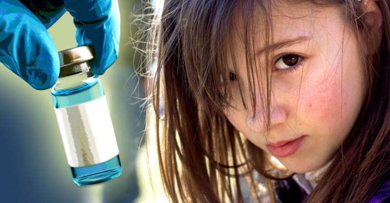 girl and vaccine bottle