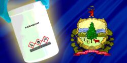Vermont flag and bottle of paraquat