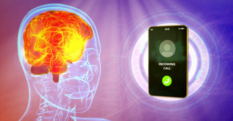 Image of cell phone radiating human brain