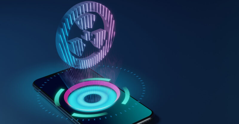 Cell phone with 3D graphic of radiation symbol.